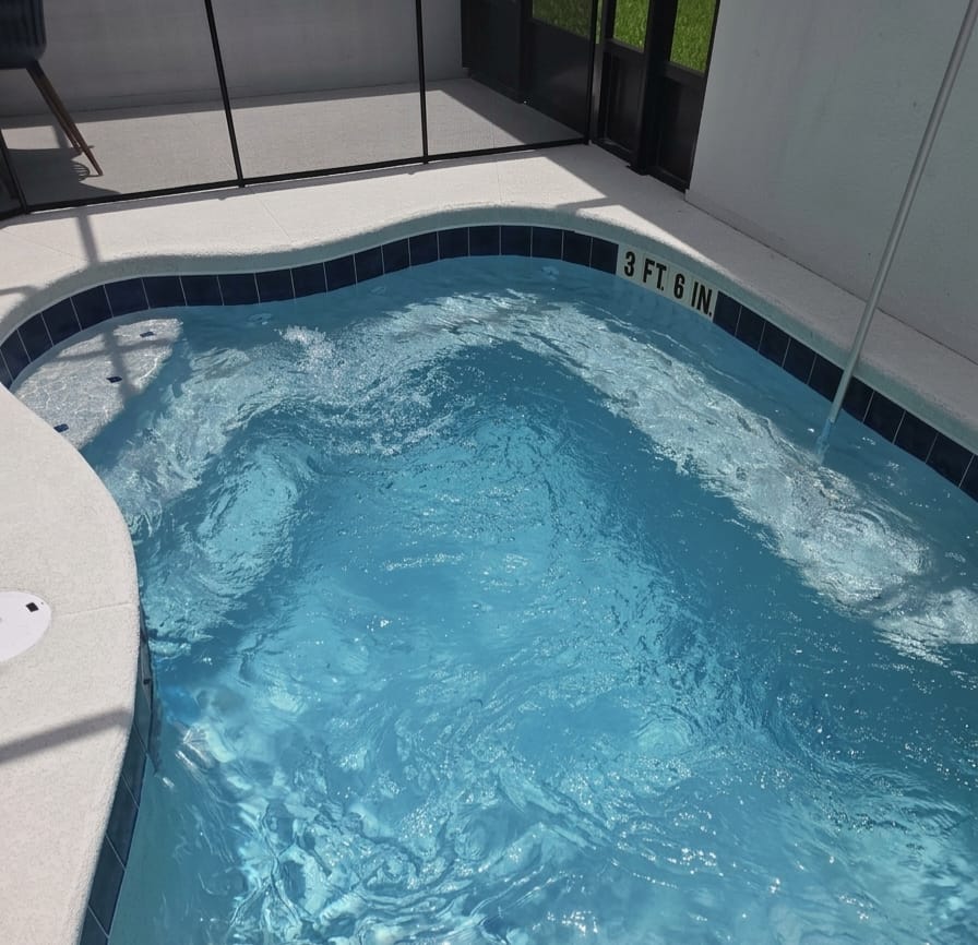 Pool with active spa jets and clean tile line